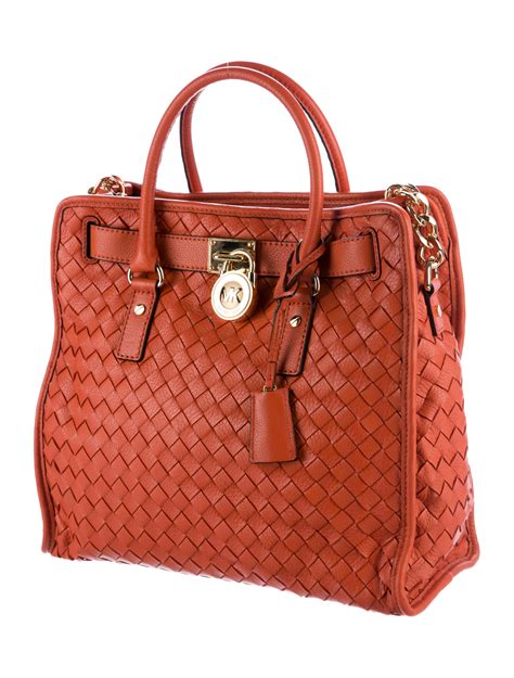 michael kors woven handbags.